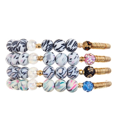 La silicona de la raya de la cebra gotea la barra de metal del oro que la pulsera elástica hecha a mano fijó el color de Mulit